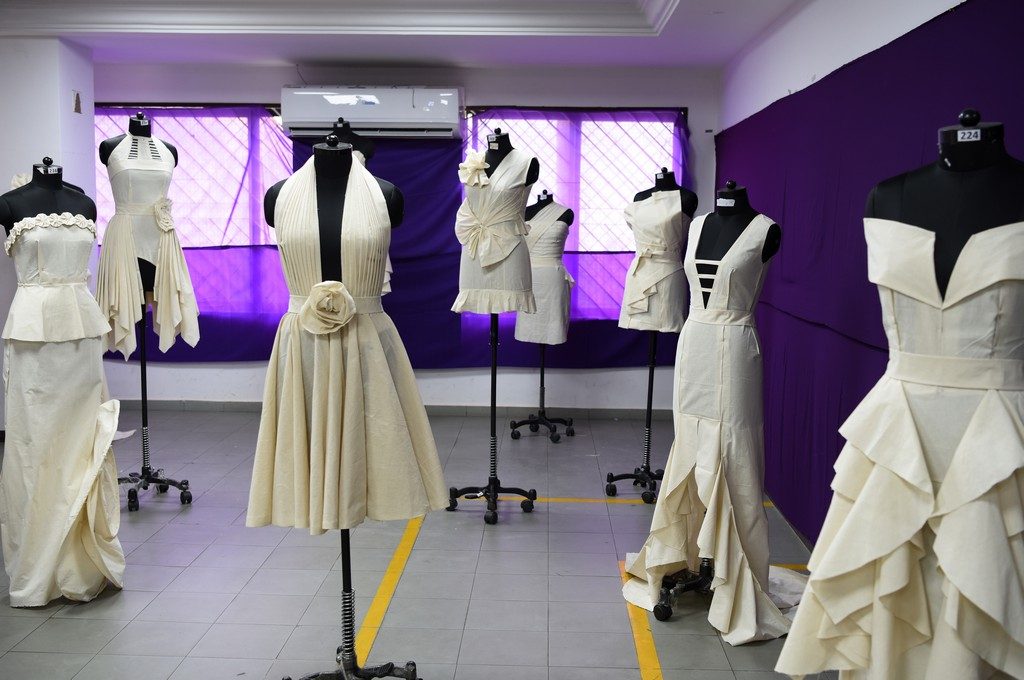 Fashion Design Students creating wonders by folding and pinning the