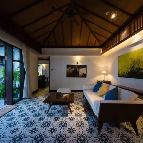 Different types of lighting are incorporated into a living room based on the needs and preferences of the clients.