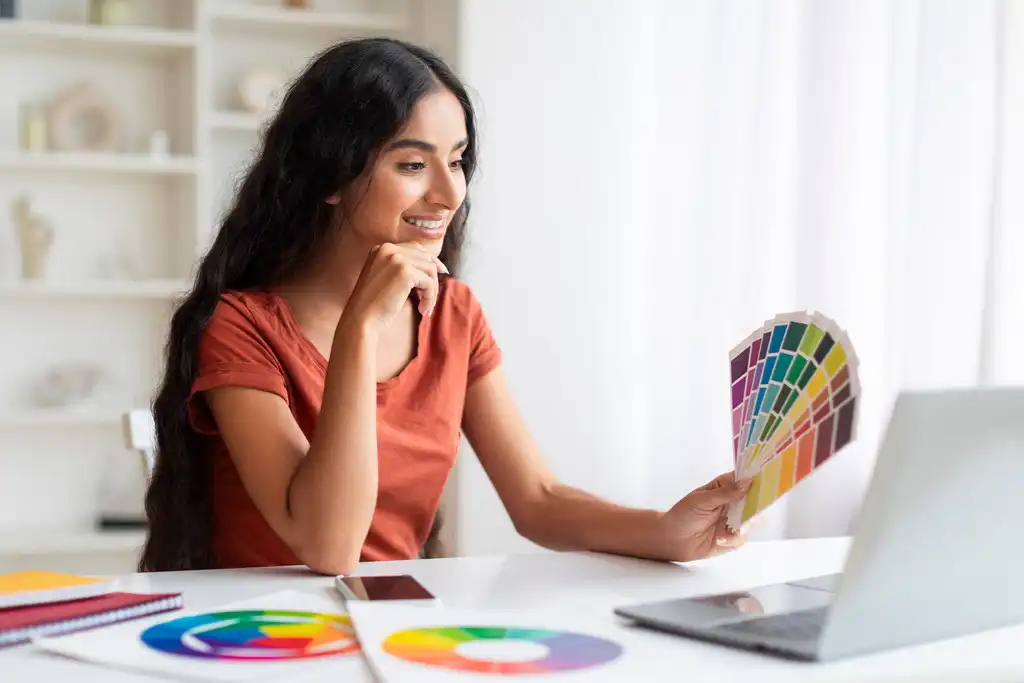 Creative indian woman planning with color wheel on desk Creative indian woman planning with color wheel on desk